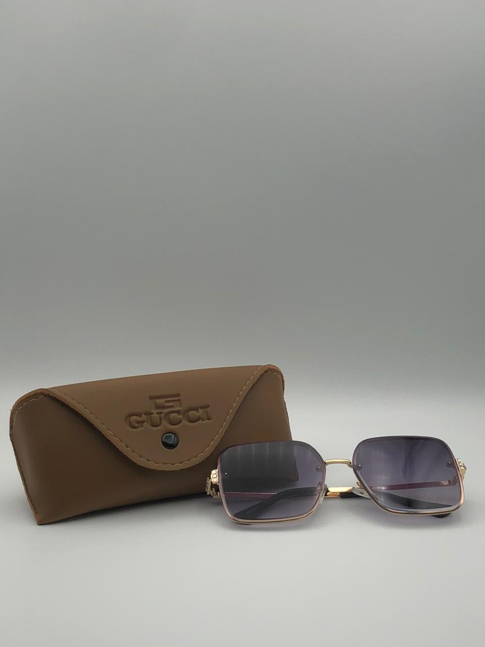 Gucci GG0817S Italian-made AAA Grade square sunglasses with golden frame and blue gradient lenses on white background.